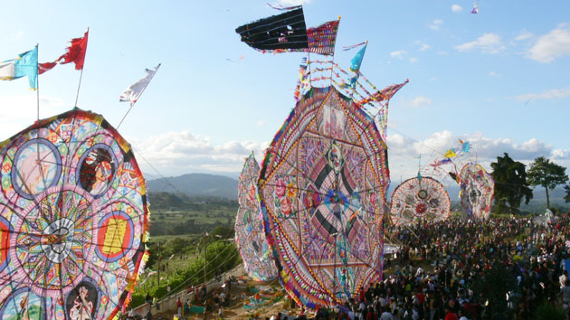By late afternoon, the cemetery is transformed by the presence of thousands of visitors who come to admire the enormous and colorful kites.&nbsp;<span class='italic'>Photo Credit:&nbsp;Tepeu Roberto Poz Salanic</span>
