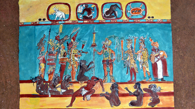 Reproduction of mural in Room 2. Members of King Ahau Chan Muwan's court display their power over the defeated rivals in a brutal battle scene. Up above, two Maya <a href='#' class='glossary-tip' title="Defined patterns formed by groupings of prominent stars in the night sky.">constellations</a> bear witness to the event and may link the battle scene to the Maya <a href='#' class='glossary-tip' title="A symbolic narrative of how the world came to be and how humans first appeared on Earth.">creation story</a>. The Peccaries (Pleiades) and the Turtle (Orion) would have been visible in the late night sky on the date of the battle. &nbsp;<span class='italic'>Photo Credit:&nbsp;Patricia Margarita Martín Morales</span>