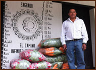 Photo of vendor standing in front of calendar painting.